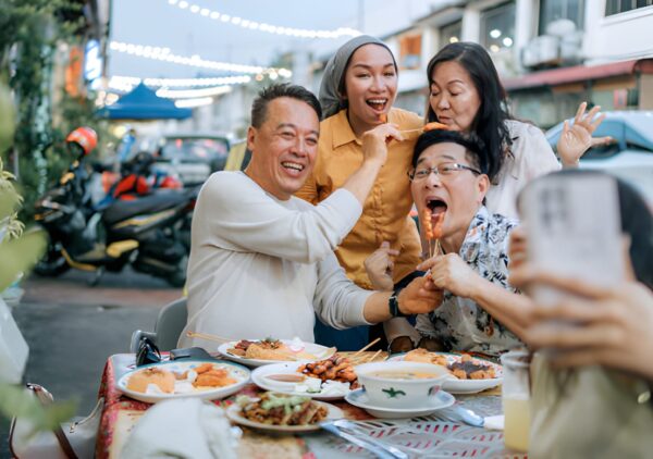 Summit attendees enjoying Cypriot cuisine and traditional music at a local restaurant after conference sessions.